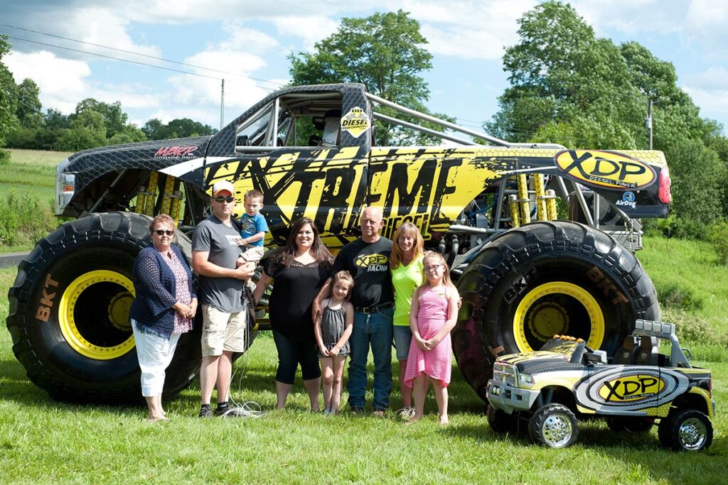 Dave with Jackson's family in front of the XDP Monster Truck